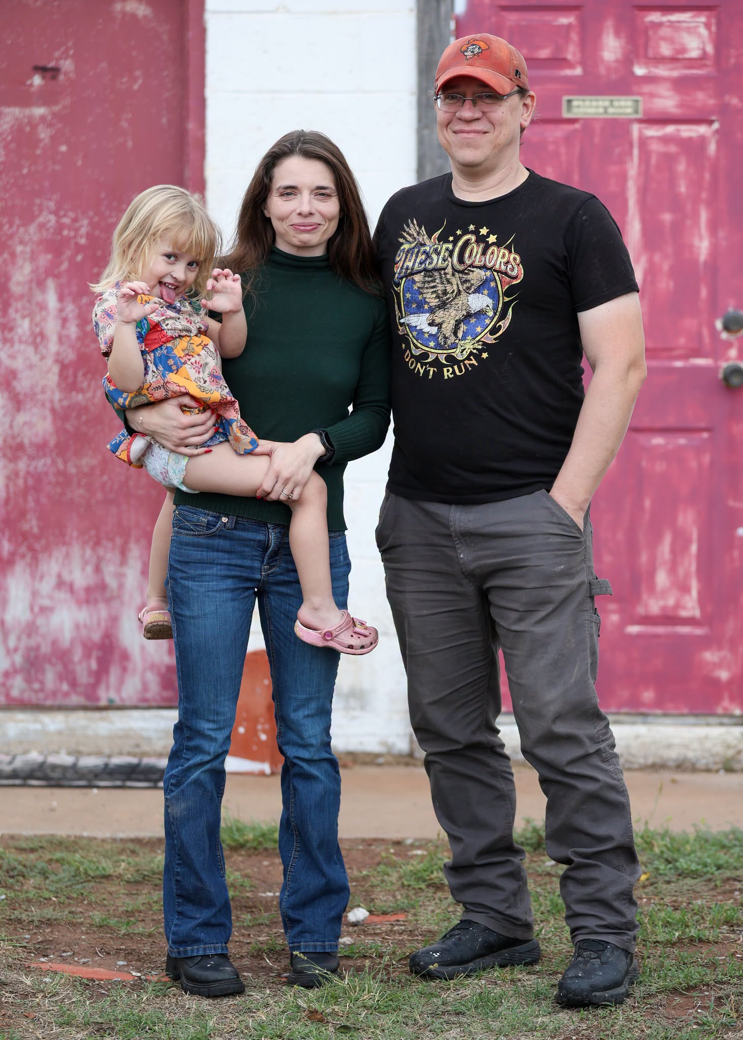 Autumn Christian with her husband and daughter outside the family cheese building